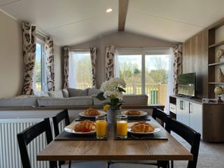 Breakfast laid on the farmhouse table by the lodge window