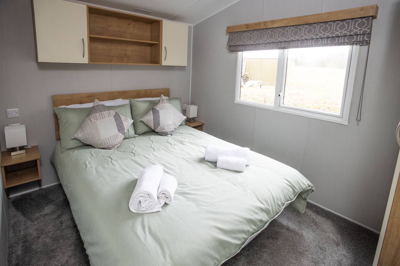 Double bed, made up with proper linens