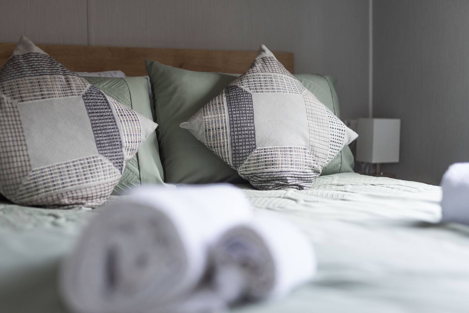 Double bed, made up with proper linens