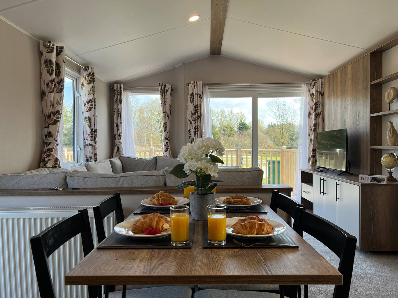 Breakfast laid on the farmhouse table by the lodge window